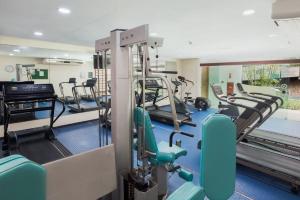 a gym with treadmills and elliptical machines at Marulhos Resort - Flat e Studio in Porto De Galinhas