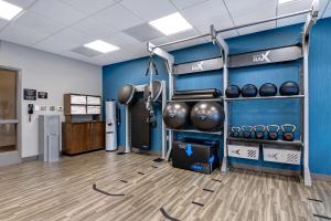 a room with a gym with a rack with weights at Hampton Inn & Suites Canal Winchester Columbus in Canal Winchester