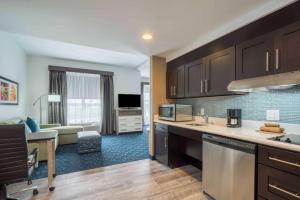 a kitchen and living room with a living room at Homewood Suites by Hilton Philadelphia Plymouth Meeting in Plymouth Meeting