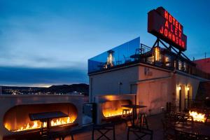 a bar with a sign on top of a building at Hotel Alex Johnson Rapid City, Curio Collection by Hilton in Rapid City