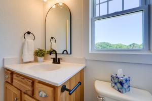 a bathroom with a sink and a mirror and a toilet at Near Ocean Buxton Townhome with Patio! in Buxton +21 photos