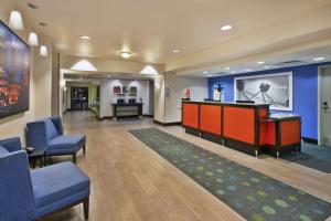 a waiting room with chairs and a bar in a hospital at Hampton Inn & Suites - Elyria in Elyria