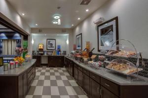 a buffet line in a hotel with food on display at Hampton Inn & Suites - Elyria in Elyria