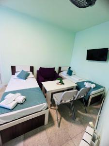 Postel nebo postele na pokoji v ubytování MarNar Hotel