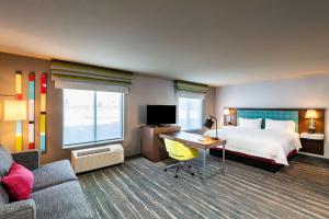 a hotel room with a bed and a desk at Hampton Inn & Suites Keller Town Center in Keller