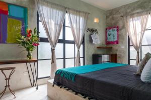 Llit o llits en una habitació de Turquoise Tulum Hotel