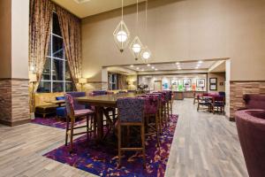 a dining room with a long table and chairs at Hampton Inn & Suites Leavenworth in Leavenworth