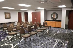 a conference room with chairs and a podium at Hampton Inn & Suites Grenada in Grenada