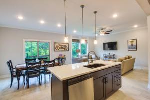 a kitchen and dining room with a table and chairs at Parkville Vacation Rental Near Creekside Complex! in Lansing