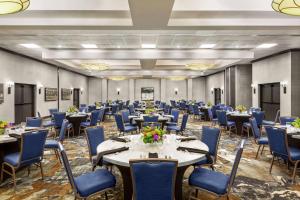 a banquet hall with tables and chairs in a room at DoubleTree by Hilton Jackson in Jackson