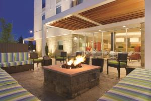 a fire pit in the middle of a patio at Home2 Suites by Hilton Bellingham in Bellingham