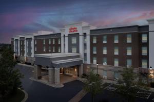 a rendering of a hotel with a building at Hampton Inn & Suites Holly Springs in Holly Springs