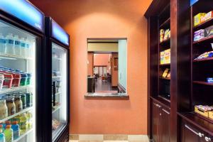 a room with an open refrigerator and a hallway at Hampton Inn & Suites Mission in Mission +26 photos