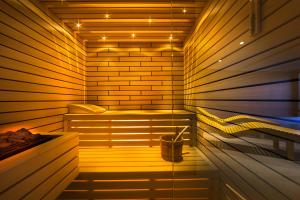 a sauna with a bed and a bucket in it at Boutique & Design Hotel Navis - Small Luxury Hotels of the World in Opatija