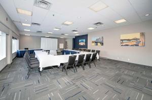 a conference room with a long table and chairs at Hampton by Hilton Ottawa in Ottawa +37 photos