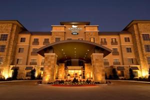 a large building with a clock on top of it at Homewood Suites Dallas-Frisco in Frisco