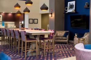 a dining room with a large table and chairs at Hampton Inn & Suites Warrington Horsham in Warrington