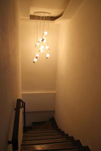 a staircase with a chandelier in a room at Starhostel Dongdaemun Suite in Seoul