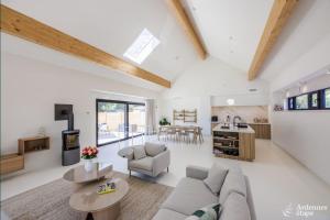 a living room with a couch and a table at La Muse in Chiny