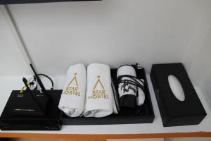 a shelf with a desk with a computer mouse and socks at Starhostel Dongdaemun Suite in Seoul