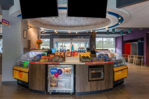 a food counter in a store with food on display at Tru By Hilton Radford in Christiansburg