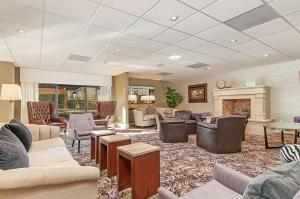 a large living room with couches and a fireplace at Hampton Inn by Hilton San Diego - Kearny Mesa in San Diego