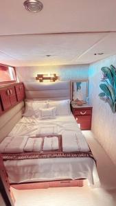 a bedroom with a large bed in a boat at Bodrum Private Yacht Rental in Bodrum City