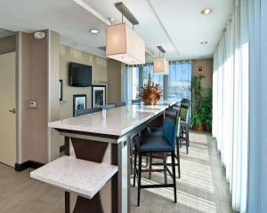 a kitchen with a large island with bar stools at Hampton Inn & Suites Mountain View in Mountain View