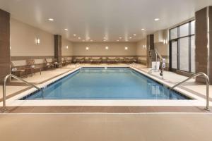 a large indoor pool in a hotel room at Embassy Suites by Hilton Akron Canton Airport in North Canton