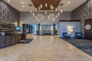 a lobby of a hotel with a chandelier at DoubleTree by Hilton North Charleston - Convention Center in Charleston +38 photos