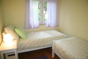 Postel nebo postele na pokoji v ubytování Sabina Apartments