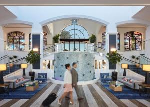 a rendering of the lobby of a hotel at The Waterfront Beach Resort, A Hilton Hotel in Huntington Beach