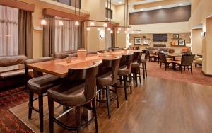 a large dining room with a long table and chairs at Hampton Inn & Suites Aberdeen in Aberdeen