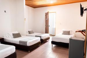 Voodi või voodid majutusasutuse Hotel Corozal Plaza toas +25 fotot