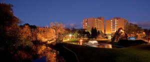 a view of a city at night with buildings at Hilton Chicago/Northbrook in Northbrook