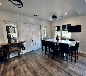 a dining room with a table and chairs at University Park Inn & Suites in Davis