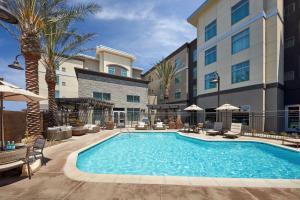 a swimming pool in front of a hotel at Homewood Suites By Hilton Los Angeles Redondo Beach in Redondo Beach