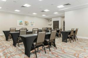 a conference room with black tables and chairs at Homewood Suites by Hilton Long Island-Melville in Plainview +25 photos