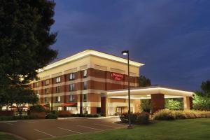 a hotel building with a sign on the front of it at Hampton Inn Atlanta-Stone Mountain in Stone Mountain