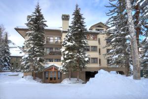 a large building with snow in front of it at Townsend Place in Beaver Creek