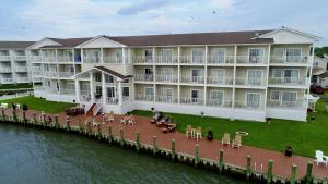a large building on a dock next to the water at Hampton Inn & Suites Chincoteague-Waterfront, Va in Chincoteague