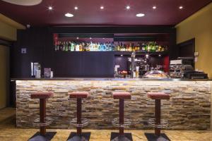 The lounge or bar area at Hotel Màgic Andorra