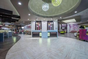 a lobby of a store with a large lobby at DoubleTree by Hilton Winston Salem - University, NC in Winston-Salem +37 photos