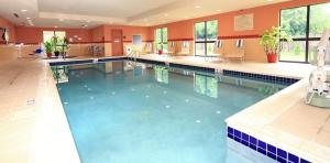 a large swimming pool in a large building at Hampton Inn and Suites of Lamar in Mill Hall