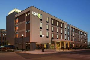 a large building with a hilton sign on it at Home2 Suites By Hilton La Crosse in La Crosse