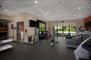 a gym with treadmills and machines in a room at Home2 Suites By Hilton Muskogee in Muskogee
