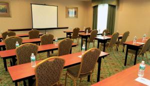 a conference room with tables and chairs with water bottles on them at Hampton Inn and Suites of Lamar in Mill Hall +37 photos