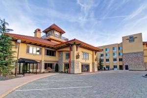 a large yellow building with a clock tower on top at Homewood Suites by Hilton Richland in Richland