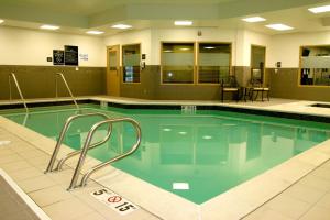 a large swimming pool with twoadders in a building at Hampton Inn & Suites Salt Lake City-University/Foothill Drive in Salt Lake City