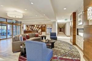 a living room with a couch and a table at Homewood Suites By Hilton Ottawa Kanata in Ottawa